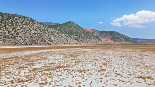 Dried Lake with Mountain Backdrop - Aerial View 4K