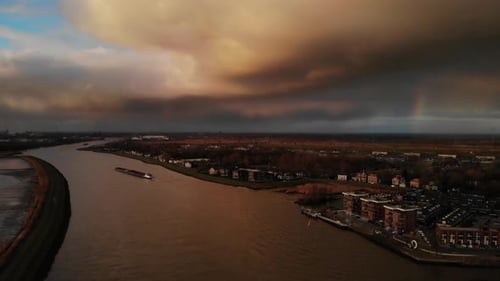 Aerial View Of Noord River With Industrial Barge Sailing At Dusk In Holland, Netherlands.