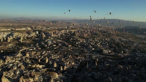 Hot Air Balloons Flying Above Goreme, Cappadocia, Turkey. Drone Aerial View of Fairy Tale Landscape