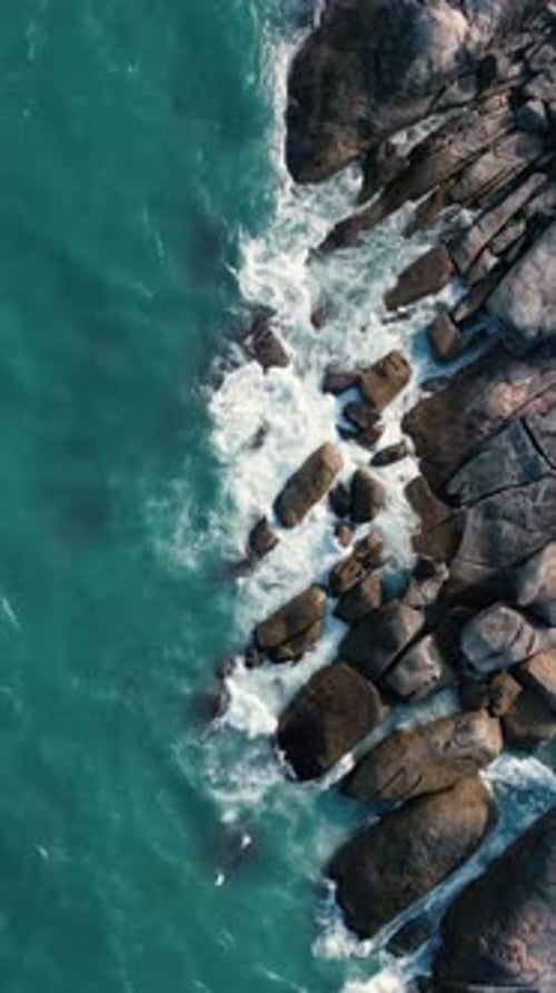 Stunning Aerial View of a Beautiful Rocky Coastline Surrounded By Turquoise Water