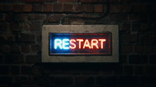 Flickering Neon RESTART Sign on Grungy Brick Wall