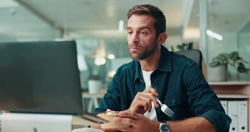 Man, eating and reading report in office with salad, laptop and working lunch with networking