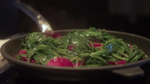Vegetables and Red Pieces Cooking in Frying Pan