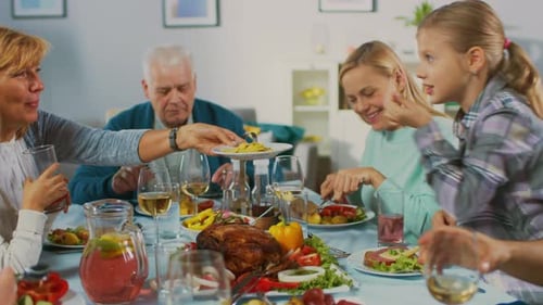 Large Family Gathering Around Table for Festive Meal