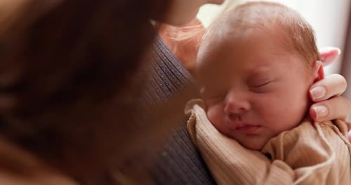 Sleeping Newborn Baby Close Up Held by Adult