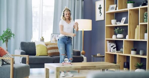 Woman Dancing at Home with Headphones