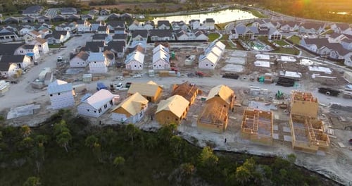 Aerial View of Suburban Home Development at Sunset