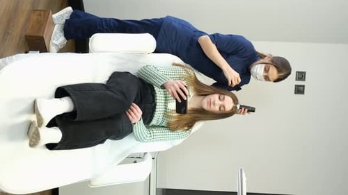 Woman Getting Hair Examined at Clinic