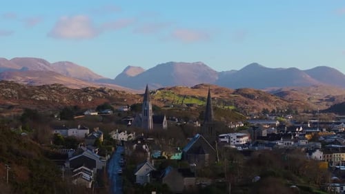 Aerial drone footage of St Joseph’s Church and Christ Church Clifden with Connemara Mountains