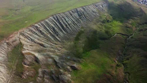 Aerial View Of Cliffs And Slanted Valley Side In Georgian Mountains