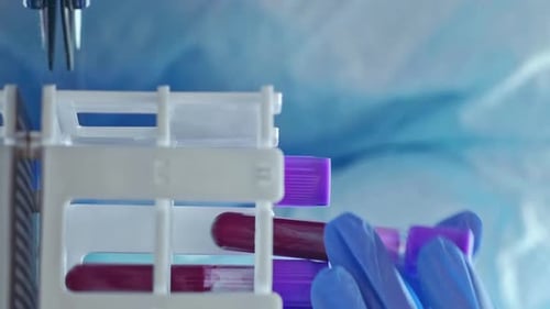 Test Tubes with Blood being Placed in Rack