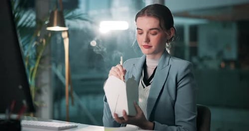 Woman, fast food and eating in office at night for work, overtime and project deadline