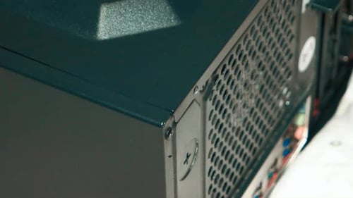 Hand Tightens Computer Case Screw