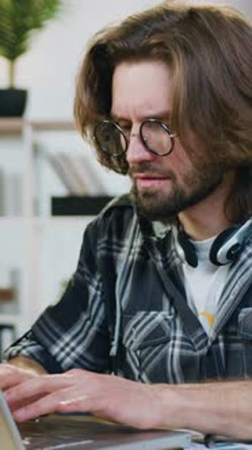 Portrait of Likable Concentrated Man Office Manager in Glasses Which Working with Start Up Project