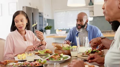 Family Together Enjoying Meal in Bright Kitchen