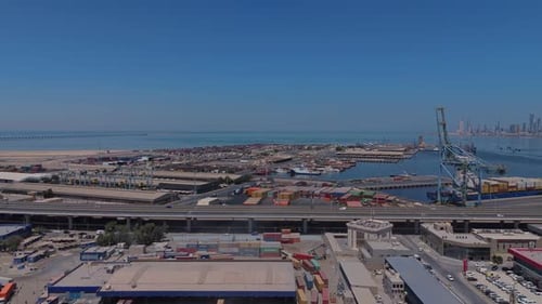 Aerial View of Bustling Port and Shipping Containers by the Sea