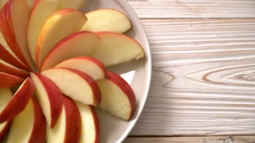 fresh red apple slice on plate