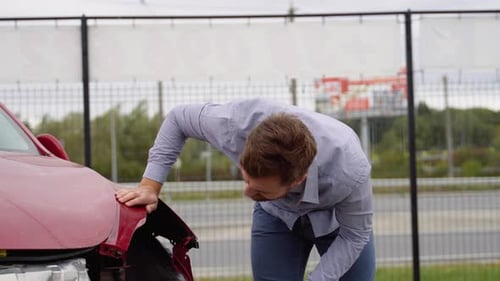 Upset Driver After Car Crash on the Road Side