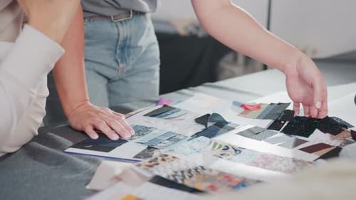 Designers Selecting Fabric Samples During Creative Project Planning