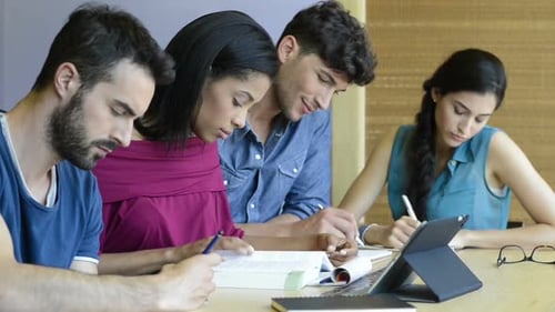 Students Studying Together at Wooden Table Indoors