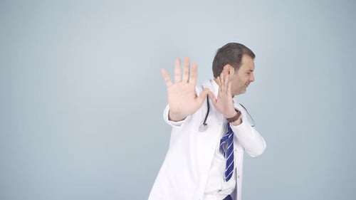 Doctor Gesturing Stop Sign for Health Advice