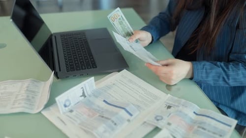 Paying Household Bills with Paper Currency and Printed Invoices