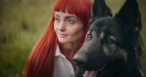 Woman and Loyal Dog Posing Together Outdoors