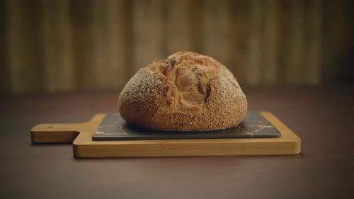 Fresh Loaf of Bread on a Cutting Board