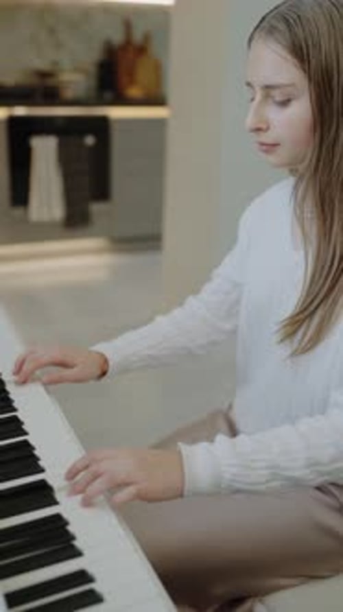 Young Woman Plays Piano in Modern Home