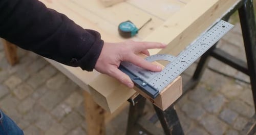 Measuring Wood with Ruler and Marker