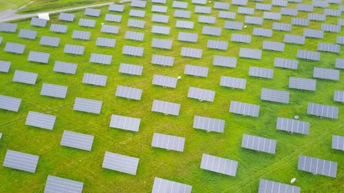 Aerial footage of Solar panels spread across a Solar farm
