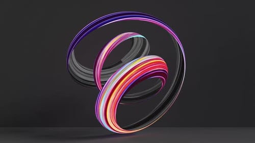 Twisted colorful ribbon loop isolated on black background