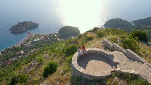Two Women Enjoying Coastal Mountain View
