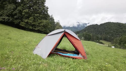 tent on a meadow in the mountains