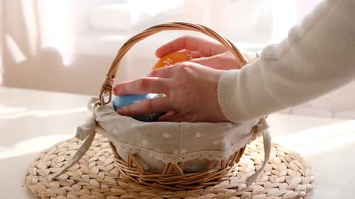Filling Easter Basket with Eggs