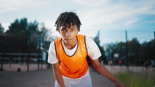 Sportive Teen Boy Playing with Ball on Streetball Court in Summer Do Sport Hobby and Healthy