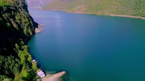Sunny day at the beautiful nature in the Aurlandsfjord in Norway. Drone dolley tilt shot