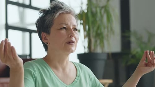 Woman Meditating Indoors for Health and Wellness