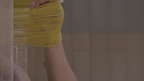 Italian Pasta Being Made on the Machine for Cutting Dough Fresh Handmade Pasta Machine Rolling Dough