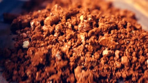 Clay stones falling from conveyor belt