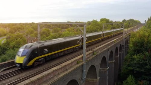 Aerial view of a moving train along the Viaduct.