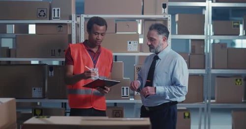 Diverse Colleagues Men Director and Executive in Uniform Cooperating in Warehouse Storage Stillage
