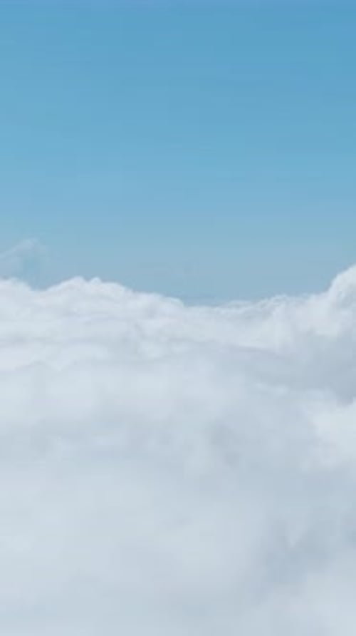 Vertical Video Stunning Clouds Roll Over a Lush Green Forest in the Mountains Offering a Calm and