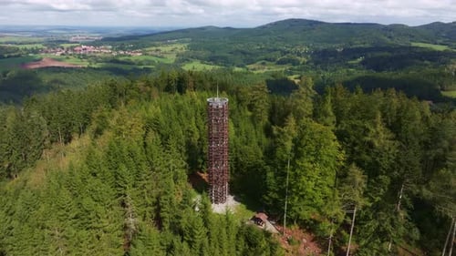 Aerial view of watch tower in lush forest, Czech Republic.