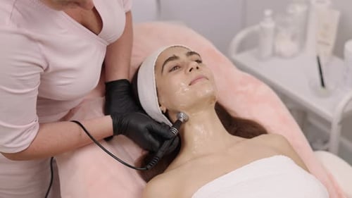 Woman receiving beauty treatment in medical office