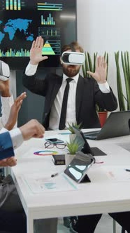 Businesspeople Using VR Headsets in Modern Office