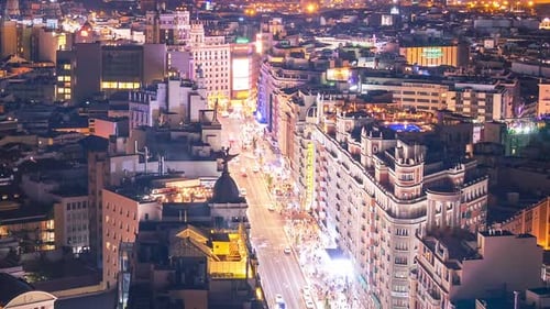 Timelapse of the Gran Via de Madrid at night. Aerial views and rooftops of Madrid.