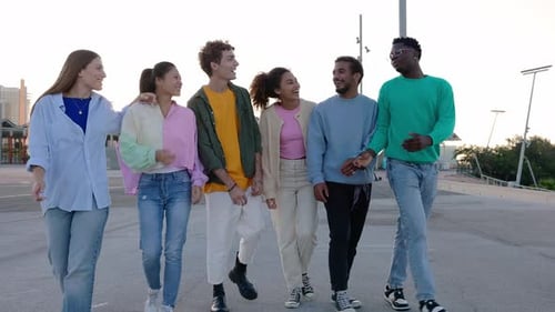 Friends Walking and Talking Together in the City