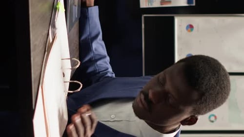 Business Man Works at Office on Laptop