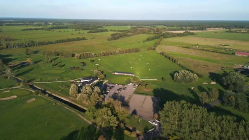 Gorgeous aerial view flight panorama orbit drone
of golf course in the forest woods. brandenburg at